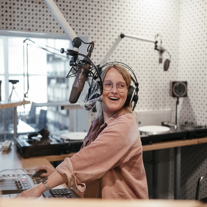 Photo: A female student is having fun being On Air in our eldoradio* radio station