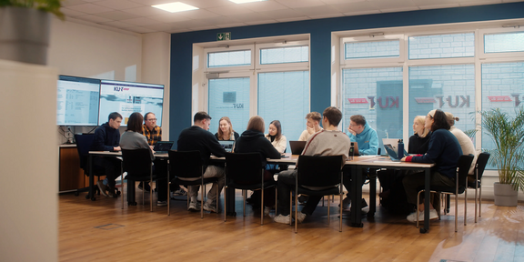 Photo: Group of students are disussing ideas during a seminar.