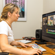 Photo: A female student is editing video material on a computer.