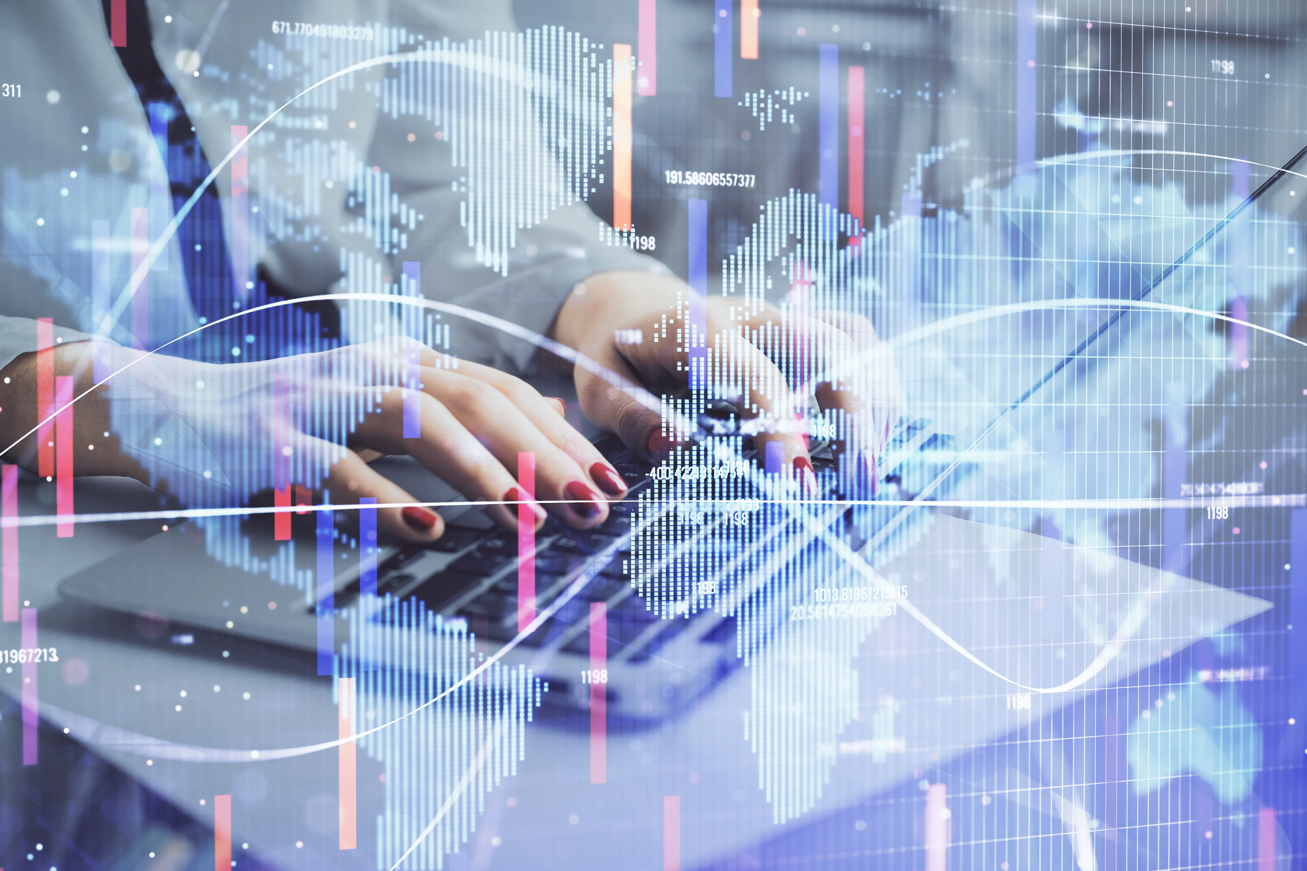 Photo: Hands are typing on a laptop, layered over the picture is a semi-transparent hologram drawing of a world map and business data visualizations