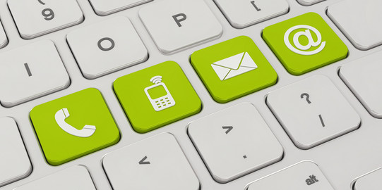 contact A white keyboard with four green keys. On the green keys are symbols like a telephone, a cell phone, an envelope and an „@“