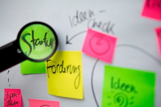 Colorful sticky notes on a white board